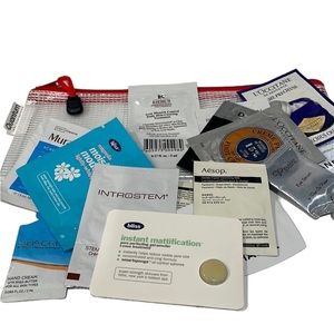 Pouch filled with assorted skincare samples - Chanel, Murad, DNA, Bliss & more
